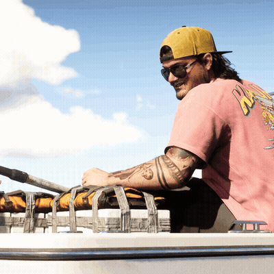 Man In Pink Shirt Saying NZ Sits On Boat GIF