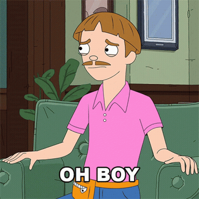 Man In Pink Shirt Sitting On Green Couch GIF