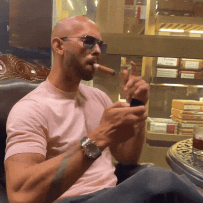 Man In Pink Shirt Smoking Cigar GIF