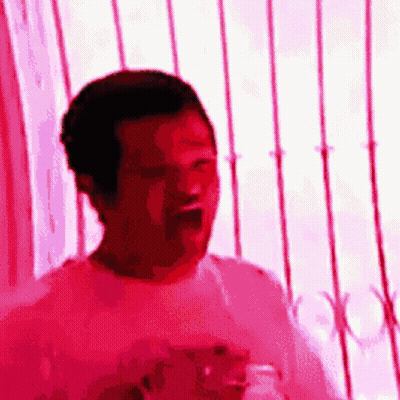 Man In Pink Shirt Standing GIF