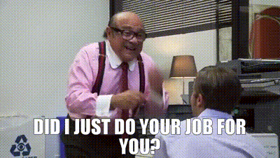 Man in Pink Shirt Talking to Another Man in Office