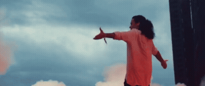 Man In Pink Shirt With Arms Outstretched GIF