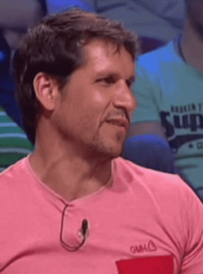 Man In Pink Shirt With Red Pocket And Neck Microphone GIF