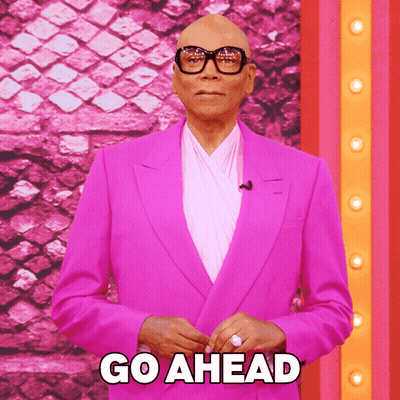 Man In Pink Suit And Glasses Says Go Ahead GIF