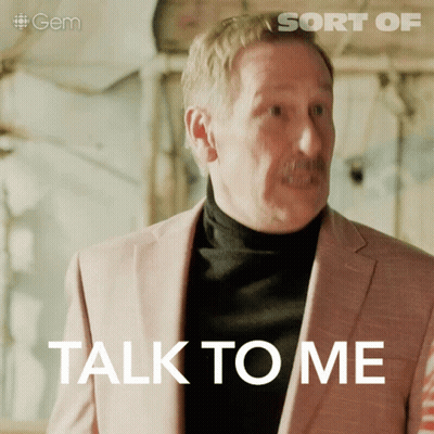 Man In Pink Suit Saying Talk To Me GIF