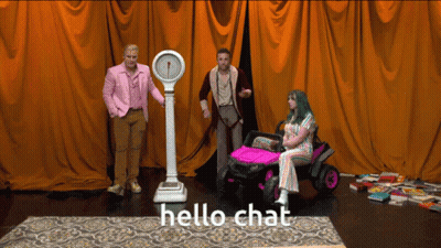 Man In Pink Suit Standing Next To Scale And Woman In Pink Car Saying Hello Chat GIF