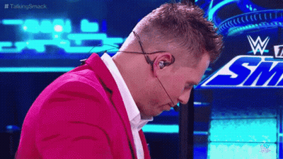 Man In Pink Suit Wearing Headset GIF
