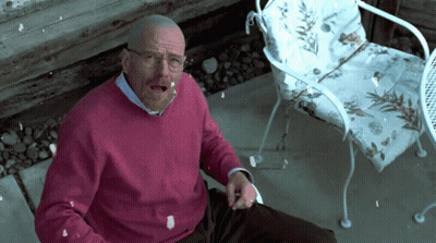 Man In Pink Sweater Sitting On Chair GIF