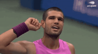 Man In Pink Tank Top Covering Ears GIF