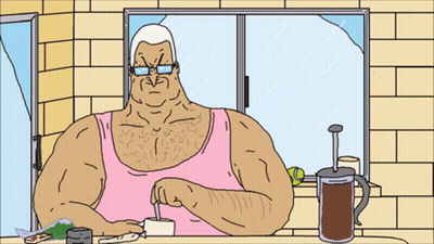 Man In Pink Tank Top Sitting At Table GIF