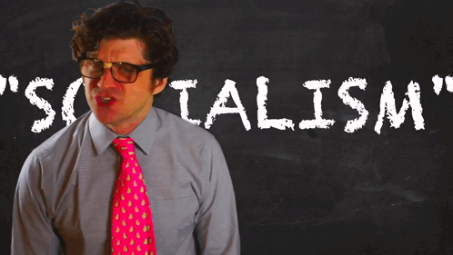 Man In Pink Tie At Blackboard Socialism GIF
