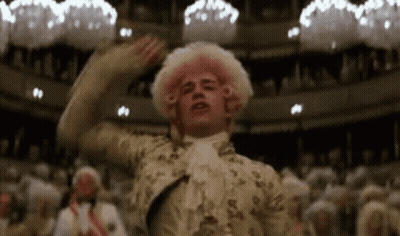 Man In Pink Wig Standing Before Crowd GIF