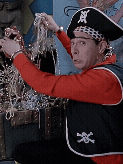 Man In Pirate Costume Holding Treasure Chest GIF