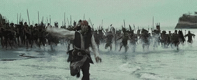 Man In Pirate Costume Running In Water With Group GIF