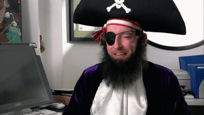 Man In Pirate Costume Sitting At Computer GIF