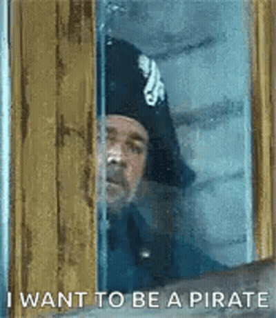 Man In Pirate Hat Looking Out Window GIF