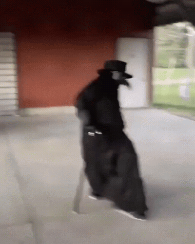 Man In Plague Doctor Costume Walking GIF