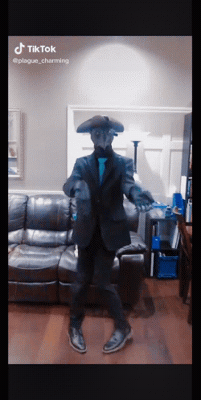 Man In Plague Mask Dancing In Living Room GIF