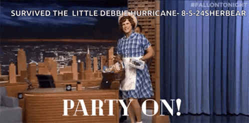 Man In Plaid Dress Standing By Party Desk GIF