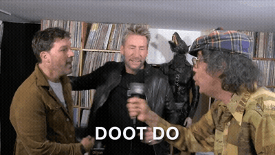 Man In Plaid Hat Holding Mic With Doot Do GIF