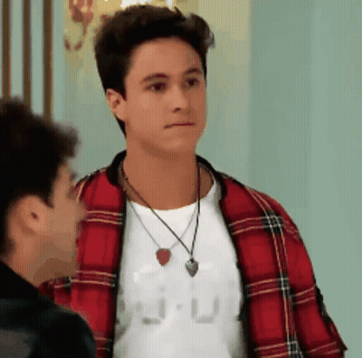 Man In Plaid Jacket And Necklace Beside Another Man GIF