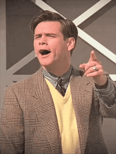 Man In Plaid Jacket And Yellow Sweater Pointing GIF
