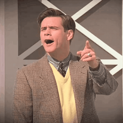 Man In Plaid Jacket And Yellow Sweater Pointing GIF