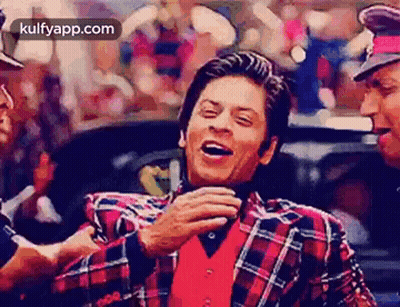 Man In Plaid Jacket Laughing With Police Officer GIF