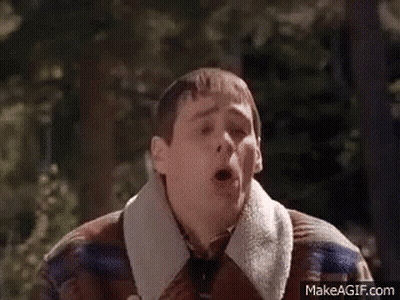 Man in Plaid Jacket Making Funny Face in Woods