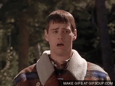 Man in Plaid Jacket Surprised in Woods