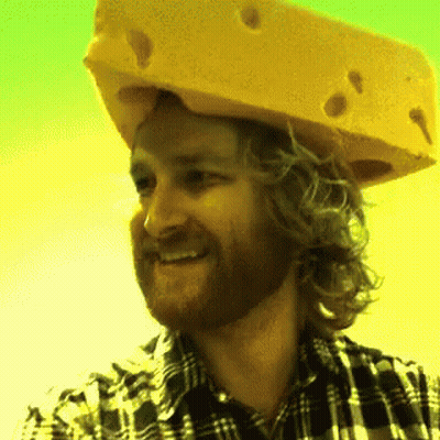 Man In Plaid Shirt And Cheese Hat Smiling GIF