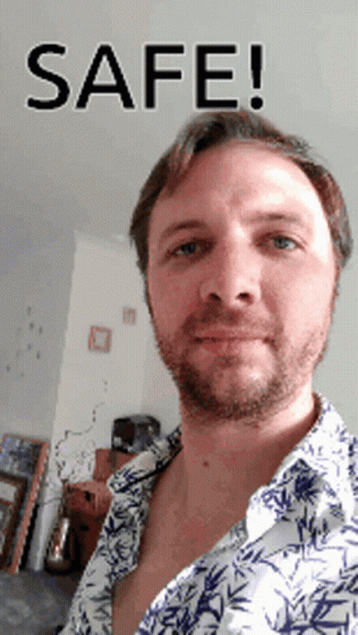 Man In Plaid Shirt And Cowboy Hat At 40 Sign GIF