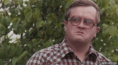 Man In Plaid Shirt And Glasses By Bush GIF