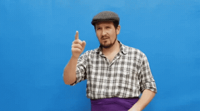 Man In Plaid Shirt And Hat Waving On Blue Background GIF
