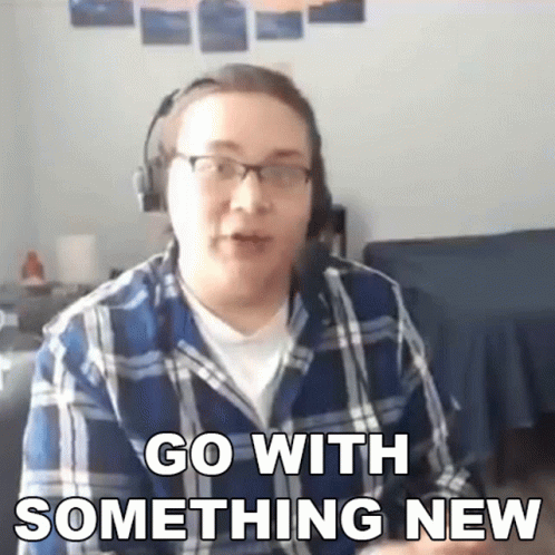 Man In Plaid Shirt And Headphones Says Go With Something New GIF