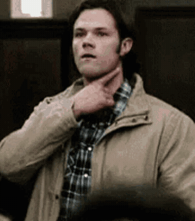 Man In Plaid Shirt And Jacket Holding Chin GIF
