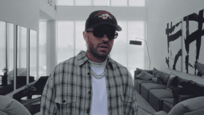 Man In Plaid Shirt And Nike Hat GIF