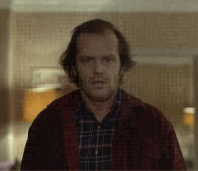 Man In Plaid Shirt And Red Jacket Looking At Camera GIF
