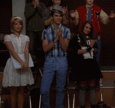 Man In Plaid Shirt And Suspenders With Two Women GIF