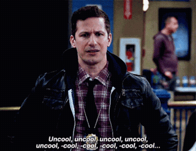 Man In Plaid Shirt And Tie Talking To Woman In Hallway GIF