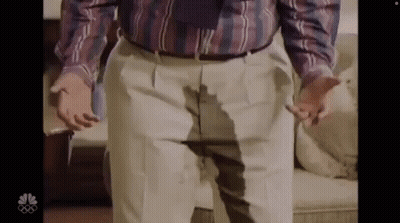 Man In Plaid Shirt And Tie With Wet Pants GIF