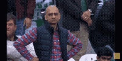 Man In Plaid Shirt And Vest Standing GIF