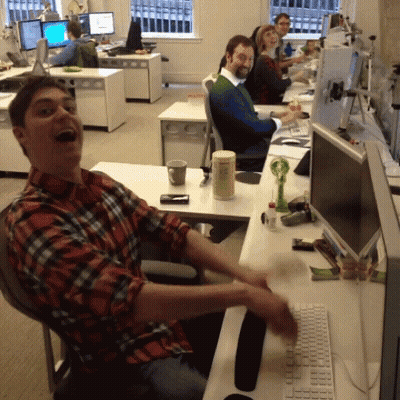 Man In Plaid Shirt At Desk With Computer Monitor GIF