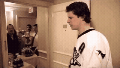 Man In Plaid Shirt At Hockey Webcast Locker GIF