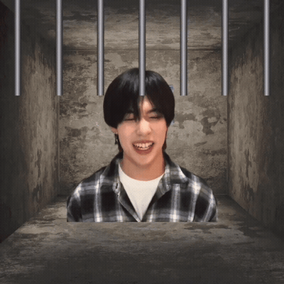 Man In Plaid Shirt Behind Bars GIF