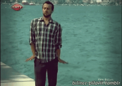 Man in Plaid Shirt by Water With TRT Logo