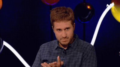 Man In Plaid Shirt Clapping With Balloons GIF