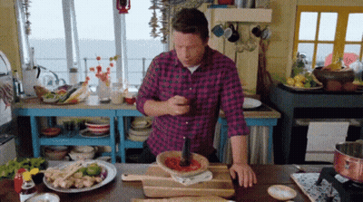 Man In Plaid Shirt Cooking In Kitchen GIF