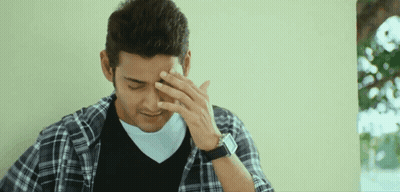 Man In Plaid Shirt Covering Face With Hand GIF