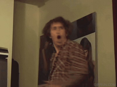 Man In Plaid Shirt Dancing In Front Of TV GIF